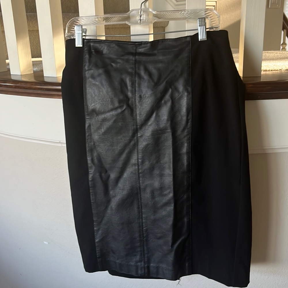 Knee skirt with leather-like panel